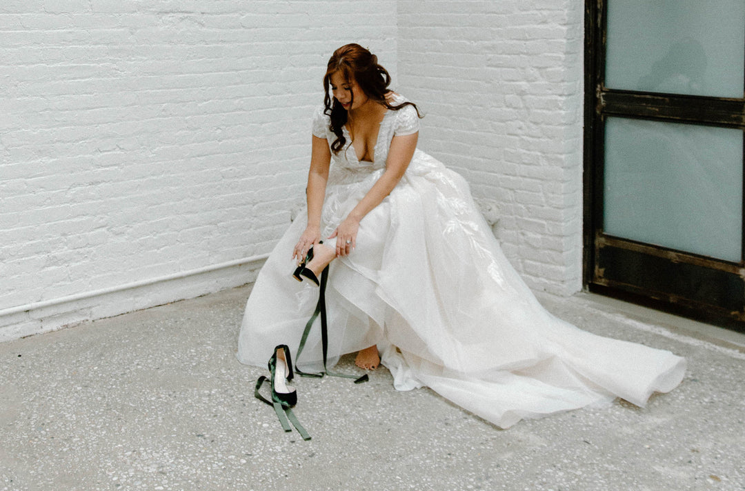 Isabella wears Hetty Forest Green Block Blossom Gold