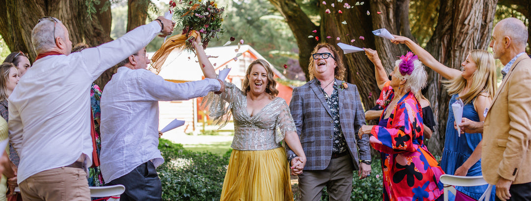 Jemma wears Hetty Mid Forest Green Blossom Small Gold